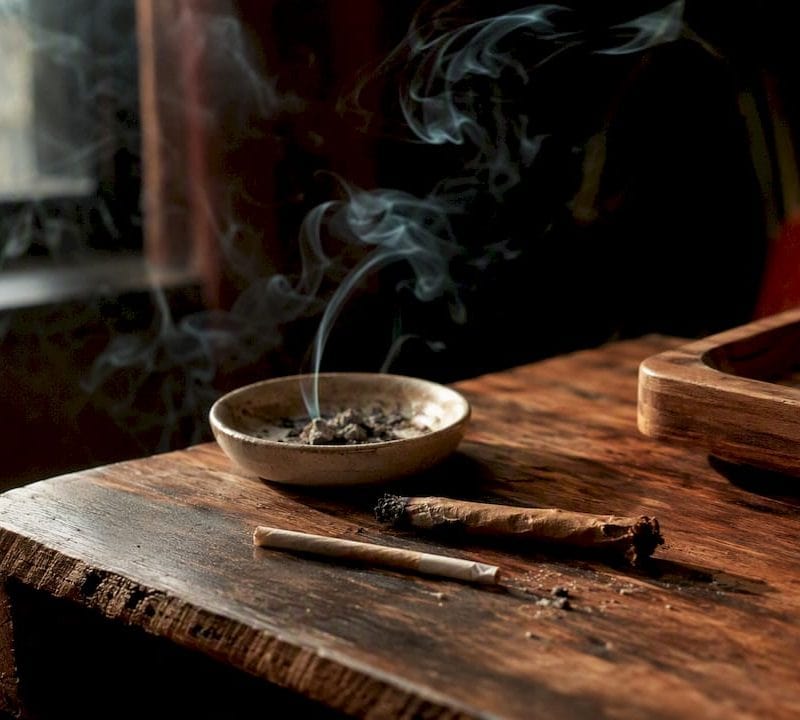 Cannabis pre-roll and blunt on wood table