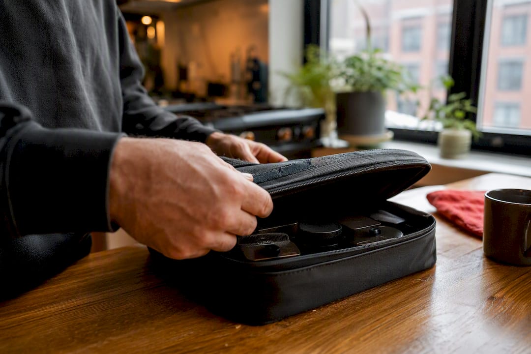 Hands opening cannabis delivery bag
