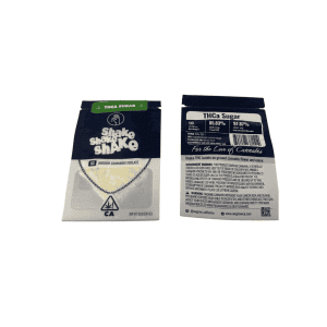 WeGrow Shake Shake Shake THCa Sugar 1G concentrate in black, green, and silver packaging, showing front and back labels with a clear window displaying pale yellow crystals.