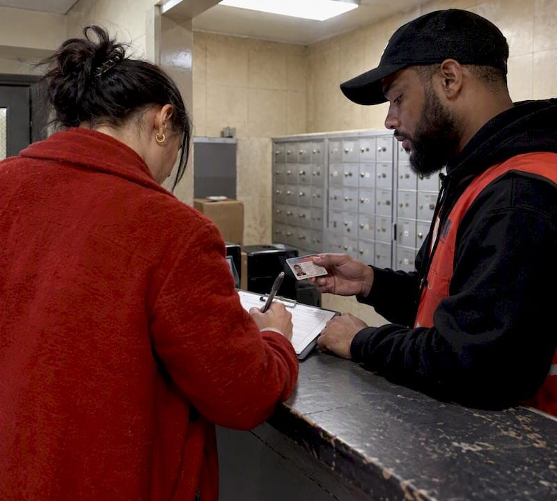 Customer presenting ID during cannabis delivery