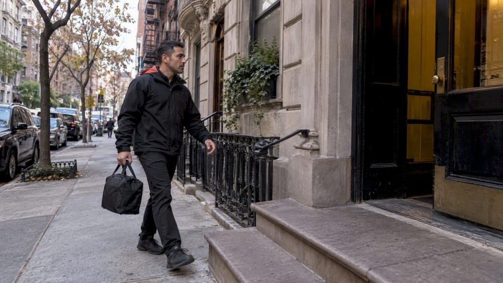 Courier approaching a Manhattan apartment before rush hour