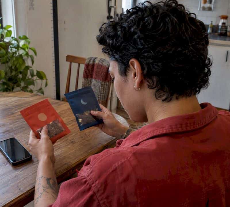 Shopper checks a cannabis edible serving label