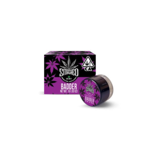 Smashed Badder 1g cannabis concentrate glass jar beside purple-accented retail packaging box
